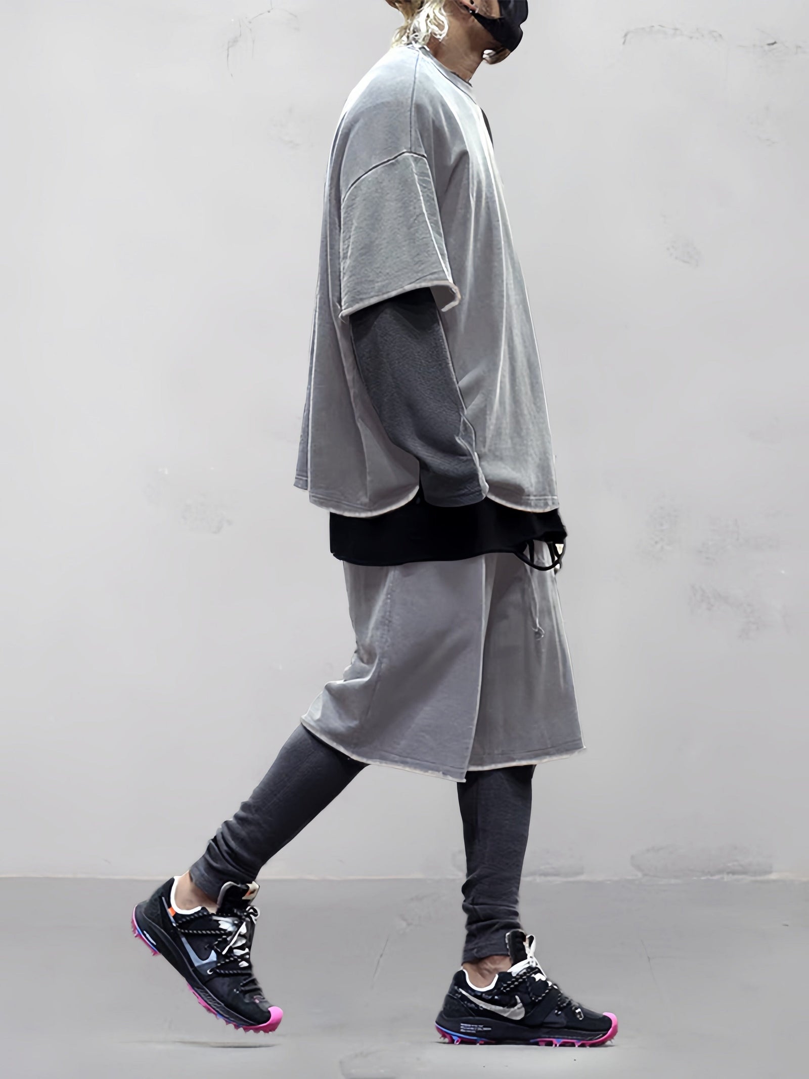 Layered streetwear styling with loose fit T-shirt and shorts set